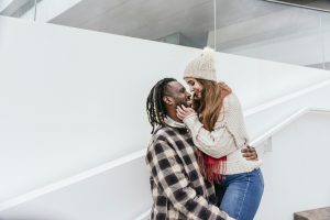 an international couple flirting outdoors